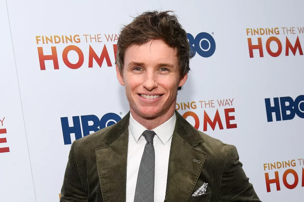 Eddie Redmayne as Tom Hayden