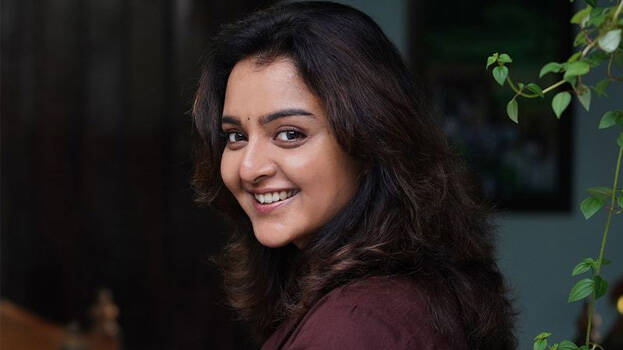 Manju Warrier as Pachaiyamal, Sivasaami's Wife and Murugesan's